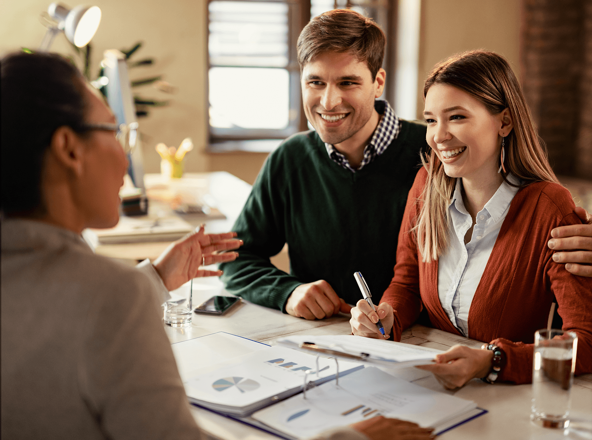 Young couple talking with investment advisor 